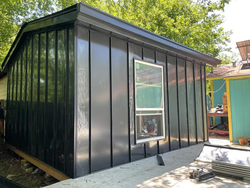 Black standing seam metal wall panels for Roof Inspection in Oviedo