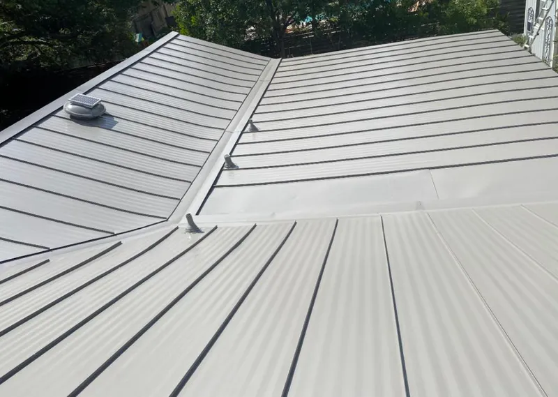 Solar attic fan installed on a metal roof for Roof Ventilation in Oviedo
